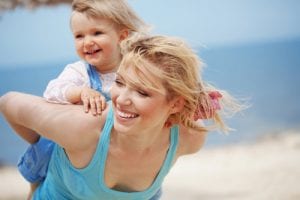 Happy family playing on the beach